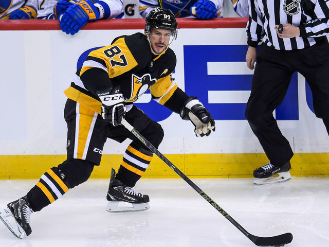 PITTSBURGH, PA - MARCH 25: Pittsburgh Penguins Center Sidney Crosby (87) skates with the puck during the first period in the NHL game between the Pittsburgh Penguins and the Buffalo Sabres on March 25, 2021, at PPG Paints Arena in Pittsburgh, PA.