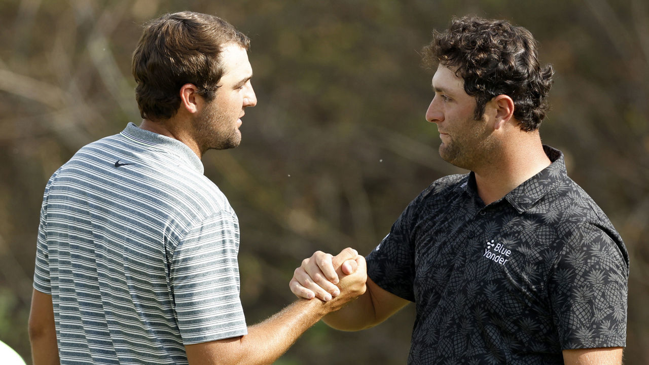 AUSTIN, TEXAS - MARCH 27: Scottie Scheffler of the United States shakes hands with Jon Rahm of Spain after winning their match during the quarterfinal round of the World Golf Championships-Dell Technologies Match Play at Austin Country Club on March 27, 2021 in Austin, Texas.