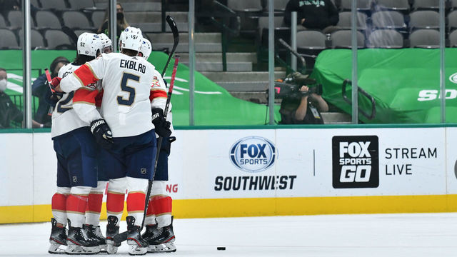 DALLAS, TX - MARCH 27: MacKenzie Weegar #52, Aaron Ekblad #5 and the Florida Panthers celebrate a goal against the Dallas Stars at the American Airlines Center on March 27, 2021 in Dallas, Texas.