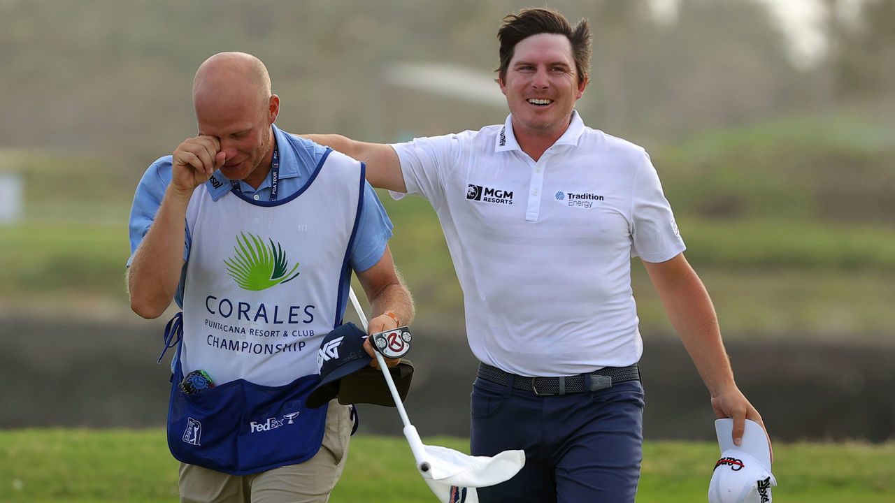 PUNTA CANA, DOMINICAN REPUBLIC - MARCH 28: Joel Dahmen reacts with his caddie Geno Bonnalie after putting in to win on the 18th green during the final round of the Corales Puntacana Resort & Club Championship on March 28, 2021 in Punta Cana, .