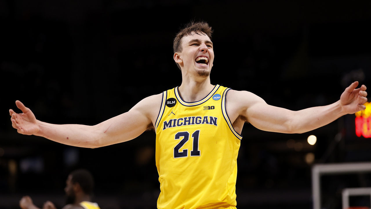 INDIANAPOLIS, INDIANA - MARCH 28: Franz Wagner #21 of the Michigan Wolverines celebrates in the final moments of the second half of their Sweet Sixteen round game against the Florida State Seminoles in the 2021 NCAA Men's Basketball Tournament at Bankers Life Fieldhouse on March 28, 2021 in Indianapolis, Indiana.
