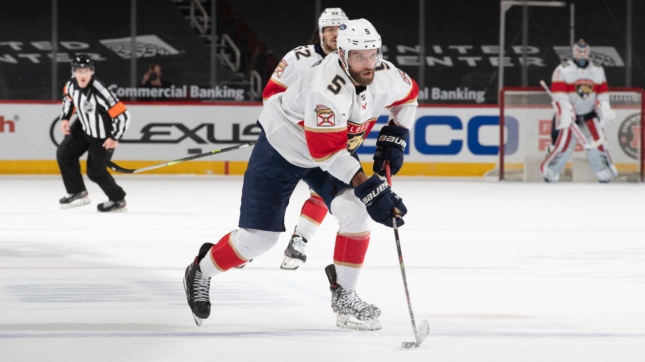 CHICAGO, IL - MARCH 23: Aaron Ekblad (5) of the Florida Panthers carries the puck into the offensive zone at the United Center on March 23, 2021 in Chicago, Illinois.