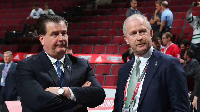 CHICAGO, IL - JUNE 23: Vancouver Canucks general manager Jim Benning meets with Dallas Stars general manager Jim Nill during the 2017 NHL Draft at the United Center on June 23, 2017 in Chicago, Illinois.