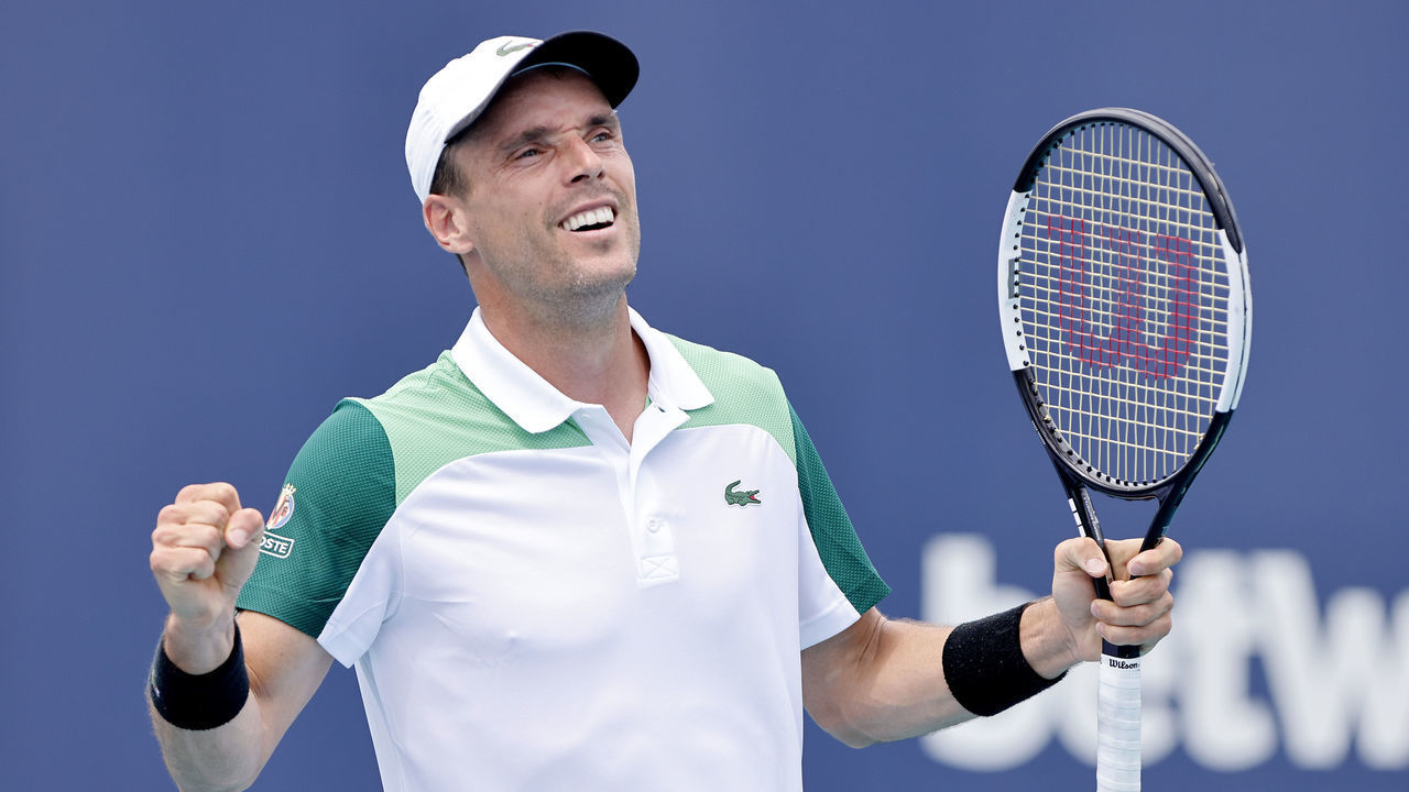 MIAMI GARDENS, FLORIDA - MARCH 30: Roberto Bautista Agut of Spain celebrates after defeating John Isner of the United States during the Miami Open at Hard Rock Stadium on March 30, 2021 in Miami Gardens, Florida.