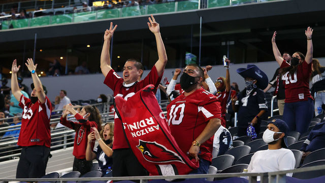 ARLINGTON, TEXAS - OCTOBER 19: Arizona Cardinals fans celebrate against the Dallas Cowboys during the fourth quarter at AT&T Stadium on October 19, 2020, in Arlington, Texas.
