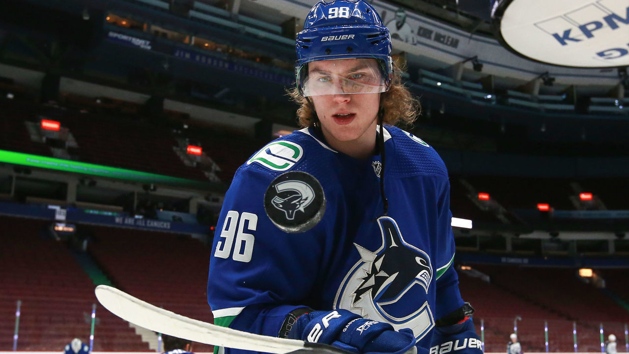 VANCOUVER, BC - MARCH 24: Vancouver Canucks Center Adam Gaudette (96) bounces a puck on his stick while warming up before playing the Winnipeg Jets during their NHL game at Rogers Arena on March 24, 2021 in Vancouver, British Columbia, Canada.