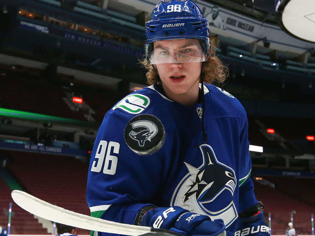VANCOUVER, BC - MARCH 24: Vancouver Canucks Center Adam Gaudette (96) bounces a puck on his stick while warming up before playing the Winnipeg Jets during their NHL game at Rogers Arena on March 24, 2021 in Vancouver, British Columbia, Canada.