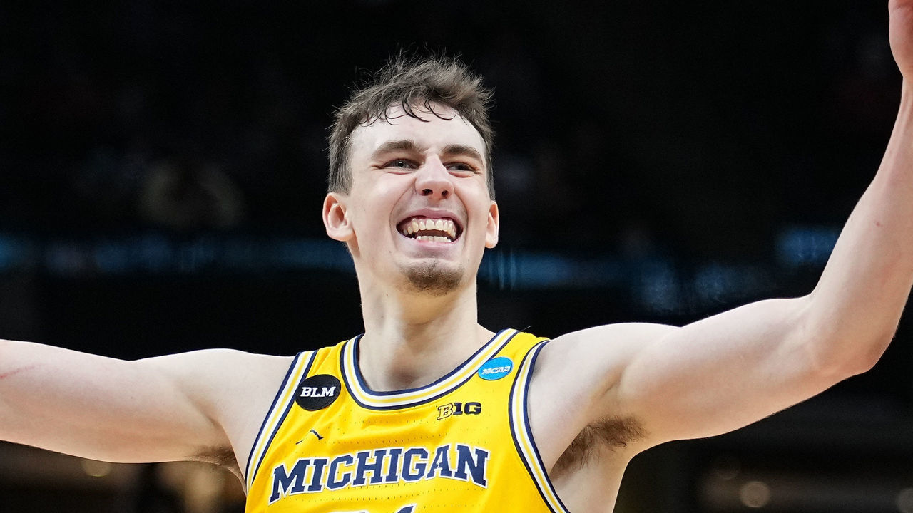 INDIANAPOLIS, IN - MARCH 28: Franz Wagner #21 of the Michigan Wolverines celebrates in the final minutes of the teams victory against the Florida State Seminoles in the Sweet Sixteen round of the 2021 NCAA Division I Mens Basketball Tournament held at Bankers Life Fieldhouse on March 28, 2021 in Indianapolis, Indiana.