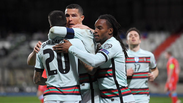 LUXEMBOURG, LUXEMBOURG - MARCH 30: Cristiano Ronaldo of Portugal celebrates with team mates (L - R) Joao Cancelo and Renato Sanches after scoring their side's second goal during the FIFA World Cup 2022 Qatar qualifying match between Luxembourg and Portugal on March 30, 2021 in Luxembourg, Luxembourg. Sporting stadiums around Luxembourg remain under strict restrictions due to the Coronavirus Pandemic as Government social distancing laws prohibit fans inside venues resulting in games being played behind closed doors.