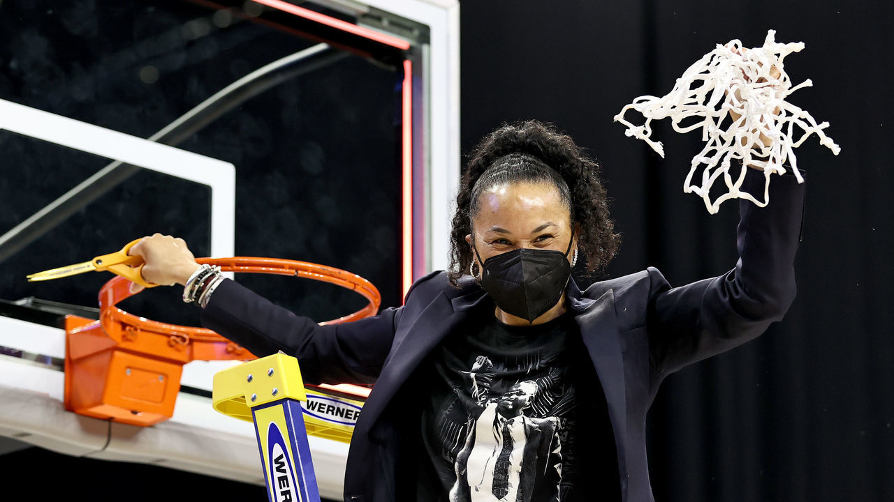 SAN ANTONIO, TEXAS - MARCH 30: Head coach head coach Dawn Staley of the South Carolina Gamecocks celebrates after cutting the last piece of the net during the Elite Eight round of the NCAA Women's Basketball Tournament at Alamodome on March 30, 2021 in San Antonio, Texas.The South Carolina Gamecocks defeated the Texas Longhorns 62-34 to advance to the Final Four.