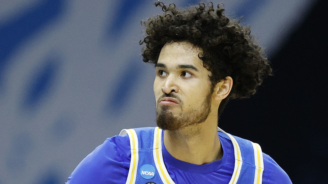 INDIANAPOLIS, INDIANA - MARCH 30: Johnny Juzang #3 of the UCLA Bruins celebrates a three point basket during the first half against the Michigan Wolverines in the Elite Eight round game of the 2021 NCAA Men's Basketball Tournament at Lucas Oil Stadium on March 30, 2021 in Indianapolis, Indiana.