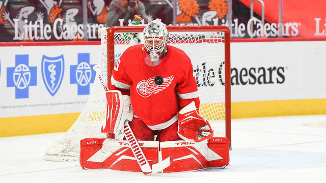 DETROIT, MI - MARCH 16: Detroit Red Wings goaltender Jonathan Bernier (45) makes a save off of his chest during the Detroit Red Wings versus the Carolina Hurricanes game on Tuesday March 16, 2021 at Little Caesars Arena Center in Detroit, MI.