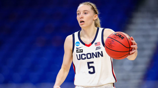 SAN ANTONIO, TEXAS - MARCH 21: Paige Bueckers #5 of the UConn Huskies controls the ball against the High Point Panthers during the first half in the first round game of the 2021 NCAA Women's Basketball Tournament at the Alamodome on March 21, 2021 in San Antonio, Texas.
