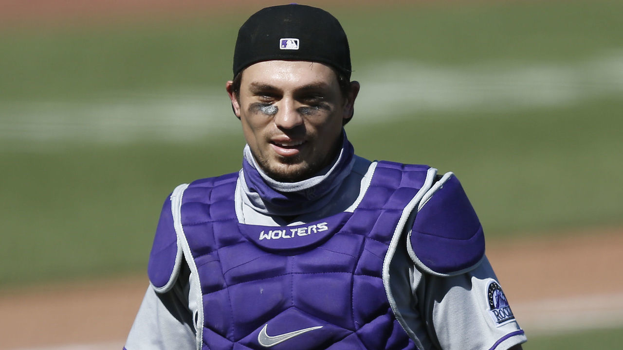 SAN FRANCISCO, CALIFORNIA - SEPTEMBER 24: Catcher Tony Wolters #14 of the Colorado Rockies walks to the dugout between innings during the game against the San Francisco Giants at Oracle Park on September 24, 2020 in San Francisco, California.