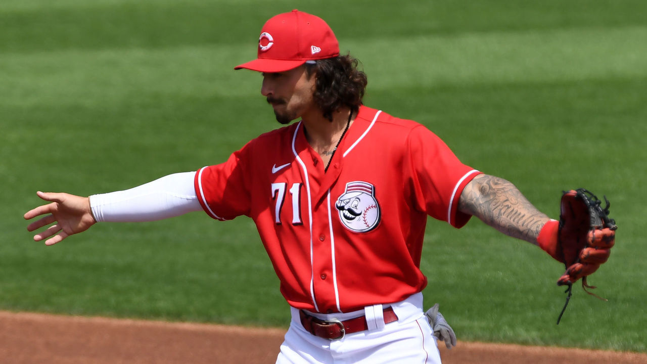 GOODYEAR, ARIZONA - MARCH 29: Jonathan India #71 of the Cincinnati Reds gestures to home plate while covering second base against the Seattle Mariners during a spring training game at Goodyear Ballpark on March 29, 2021 in Goodyear, Arizona.