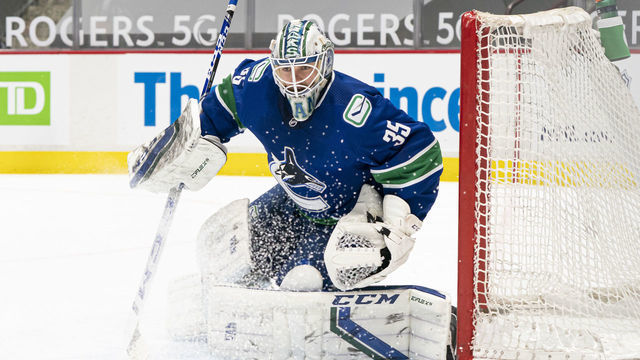 VANCOUVER, BC - MARCH 22: Goalie Thatcher Demko #35 of the Vancouver Canucks readies to make a save during NHL action against the Winnipeg Jets at Rogers Arena on March 22, 2021 in Vancouver, Canada.