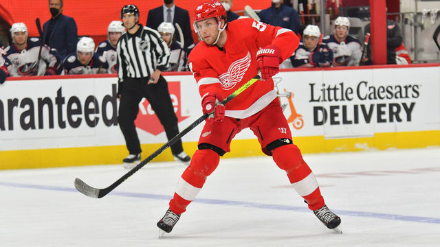 DETROIT, MI - MARCH 28: Detroit Red Wings Left Wing Bobby Ryan (54) passes the puck deeper into the zone during NHL game between Columbus Blue Jackets and Detroit Red Wings on March 28, 2021 at Little Caesars Arena in Detroit, MI