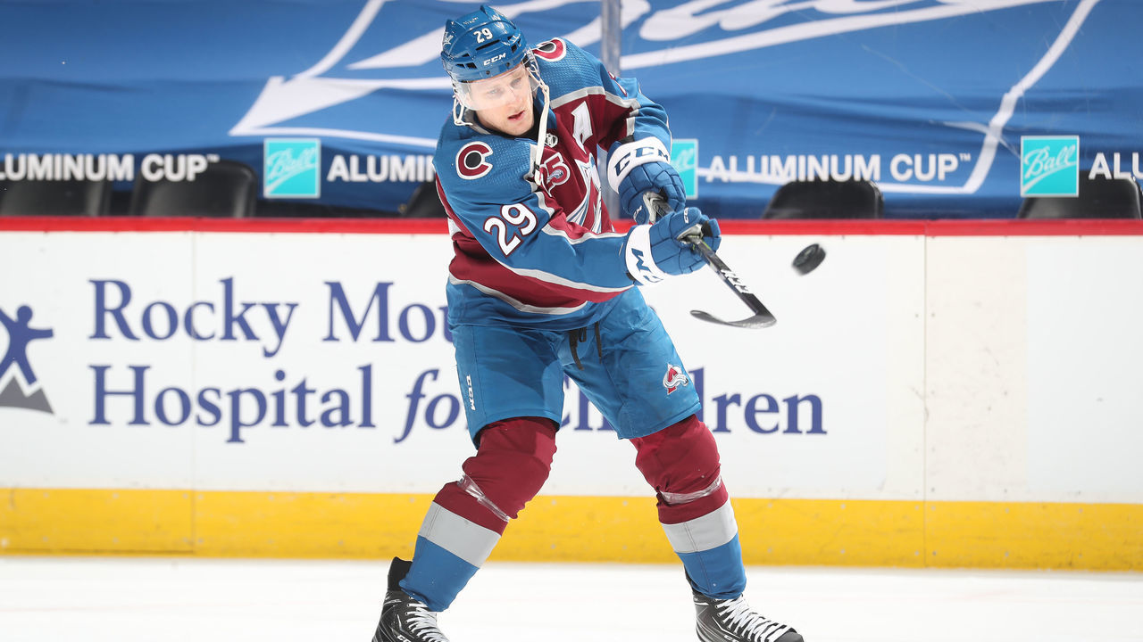 DENVER, COLORADO - MARCH 31: Nathan MacKinnon #29 of the Colorado Avalanche skates during warm ups prior to the game against the Arizona Coyotes on March 31, 2021 in Denver, Colorado.