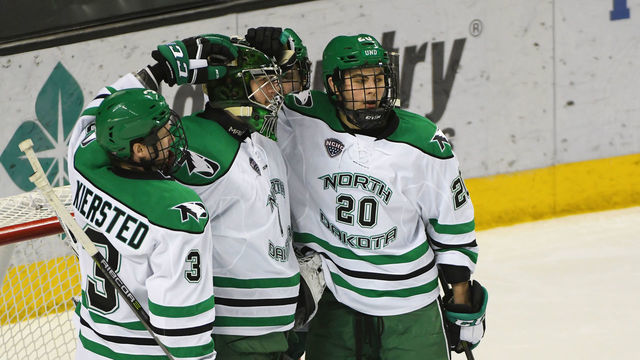 GRAND FORKS, ND - FEBRUARY 10: University of North Dakota Goalie Peter Thome (1) is congratulated by University of North Dakota Defenceman Matt Kiersted (3) and University of North Dakota Defenceman Josh Rieger (20) for a win after a college hockey game between the University of North Dakota and Colorado College on February 10, 2018 at Ralph Engelstad Arena in Grand Forks, ND. North Dakota defeated Colorado College 5-1.