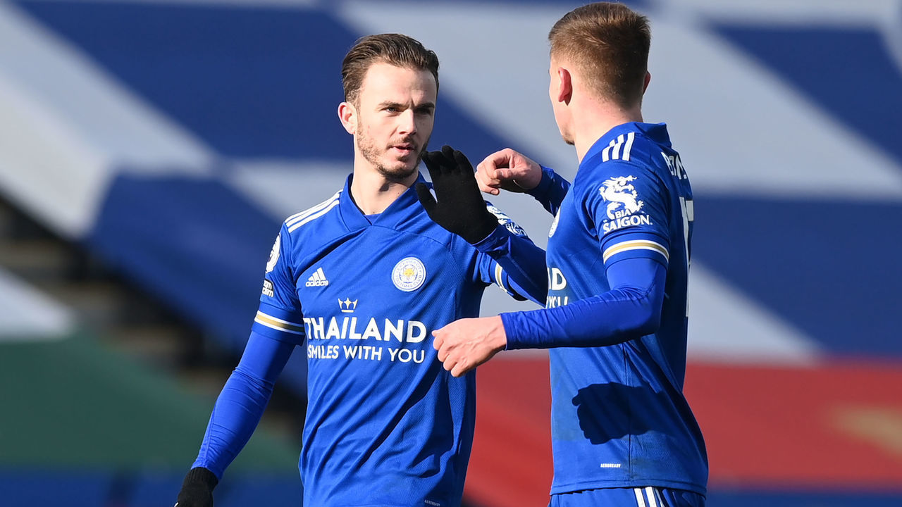Leicester City's English midfielder James Maddison (L) celebrates with Leicester City's English midfielder Harvey Barnes after he scores his team's opening goal during the English Premier League football match between Leicester City and Liverpool at King Power Stadium in Leicester, central England on February 13, 2021.