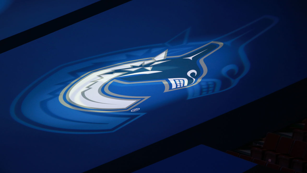 VANCOUVER, BC - FEBRUARY 23: The Vancouver Canucks logo projected on seat coverings inside Rogers Arena before the Canucks play the Edmonton Oilers during their NHL game at Rogers Arena on February 23, 2021 in Vancouver, British Columbia, Canada.