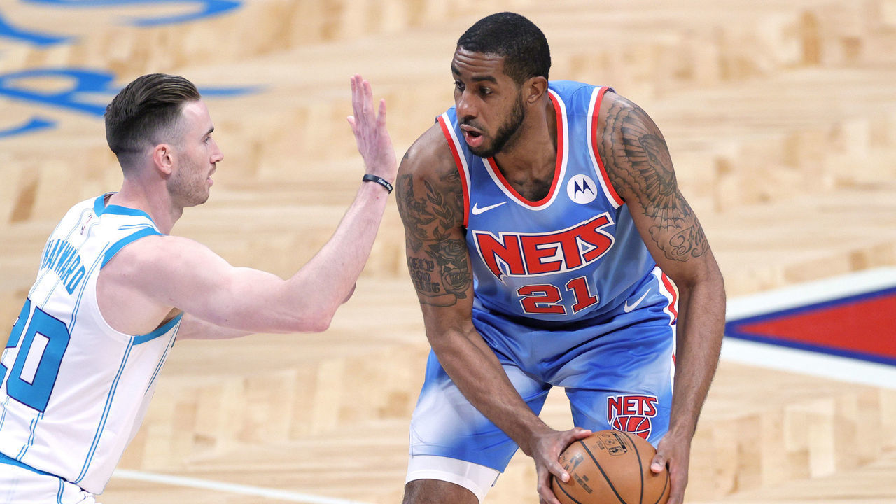 NEW YORK, NEW YORK - APRIL 01: LaMarcus Aldridge #21 of the Brooklyn Nets dribbles against Gordon Hayward #20 of the Charlotte Hornets during the first half at Barclays Center on April 01, 2021 in the Brooklyn borough of New York City.