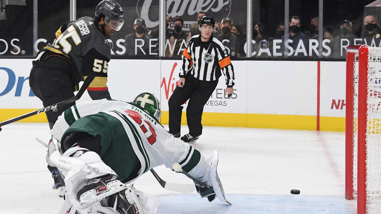 LAS VEGAS, NEVADA - APRIL 01: Cam Talbot #33 of the Minnesota Wild defends the net against Keegan Kolesar #55 of the Vegas Golden Knights in the second period of their game at T-Mobile Arena on April 1, 2021 in Las Vegas, Nevada.