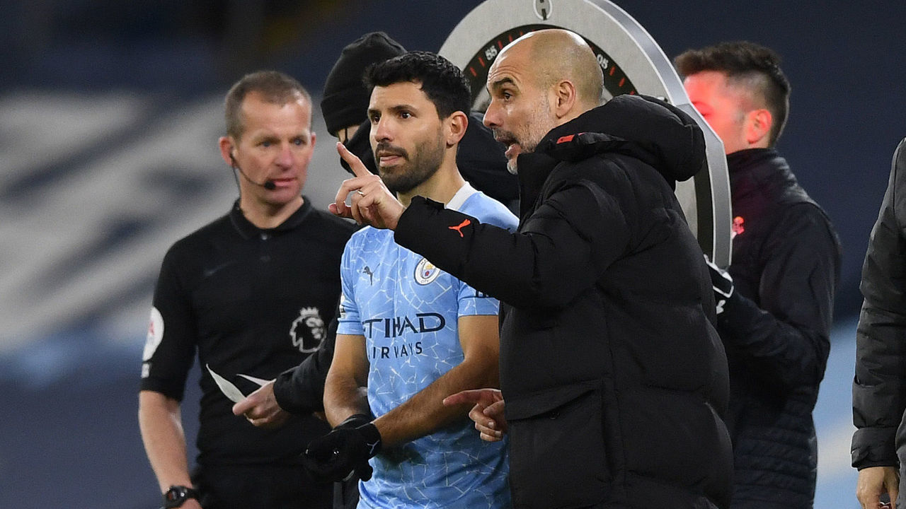 MANCHESTER, ENGLAND - MARCH 10: Sergio Aguero of Manchester City speaks with Pep Guardiola, Manager of Manchester City before entering the pitch as a substitute during the Premier League match between Manchester City and Southampton at Etihad Stadium on March 10, 2021 in Manchester, England. Sporting stadiums around the UK remain under strict restrictions due to the Coronavirus Pandemic as Government social distancing laws prohibit fans inside venues resulting in games being played behind closed doors.