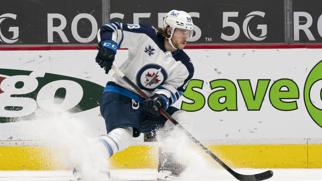 VANCOUVER, BC - FEBRUARY 19: Nathan Beaulieu #88 of the Winnipeg Jets stops while skating with the puck during NHL hockey action against the Vancouver Canucks at Rogers Arena on February 19, 2021 in Vancouver, Canada.
