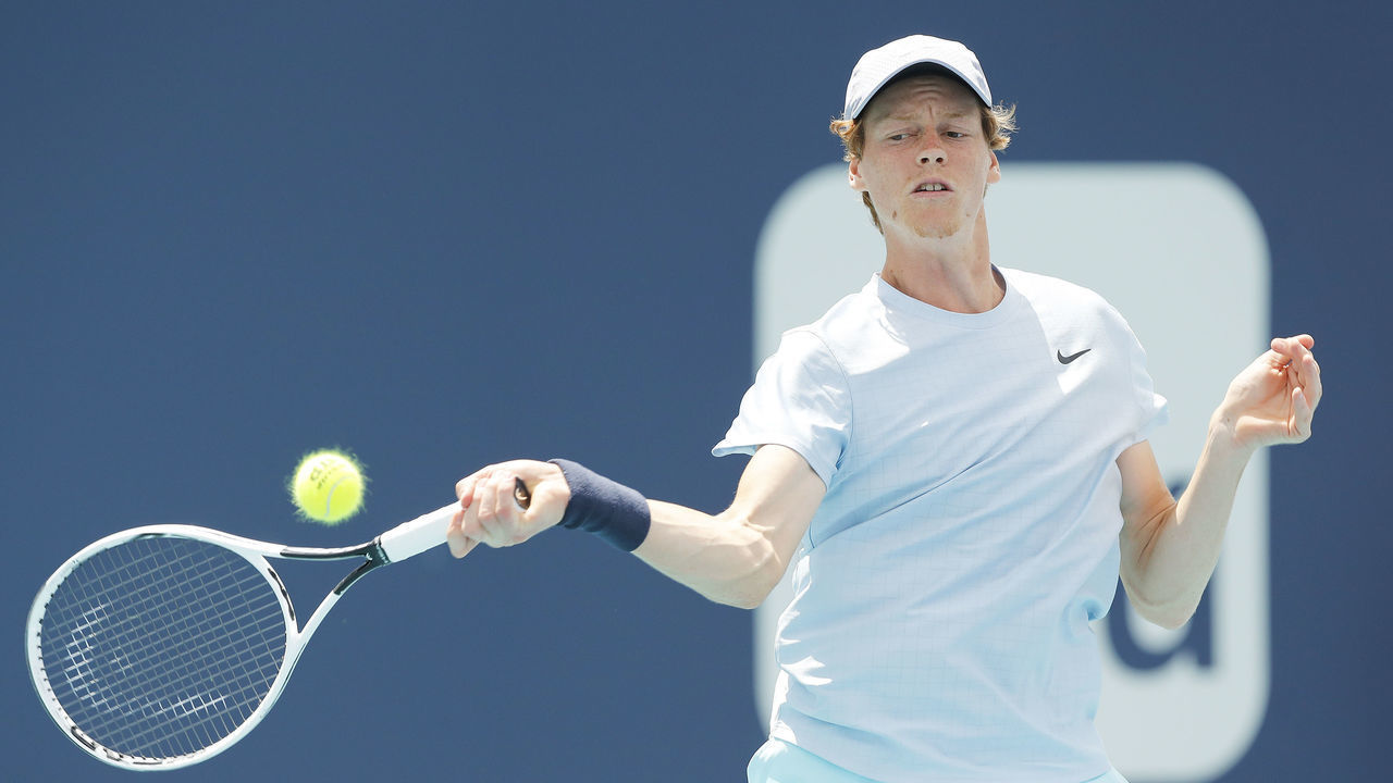 MIAMI GARDENS, FLORIDA - APRIL 02: Jannik Sinner of Italy returns a shot to Roberto Bautista Agut of Spain in their semifinal match during the Miami Open at Hard Rock Stadium on April 02, 2021 in Miami Gardens, Florida.