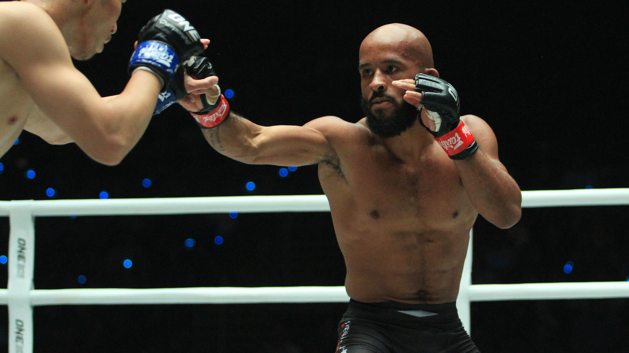 MALL OF ASIA ARENA, PASAY CITY, NCR, PHILIPPINES - 2019/08/02: Demetrious Johnson (red gloves), the pound for pound best MMA fighter in the world, showed a masterclass in combat sports by outlasting Tatsumitsu Wadda (blue gloves) of Japan to advance to the ONE Flyweight Grand Prix. With the win, he sets up a meeting with Filipine fighter Danny Kingad who won in the other semi-finals match earlier in the day.