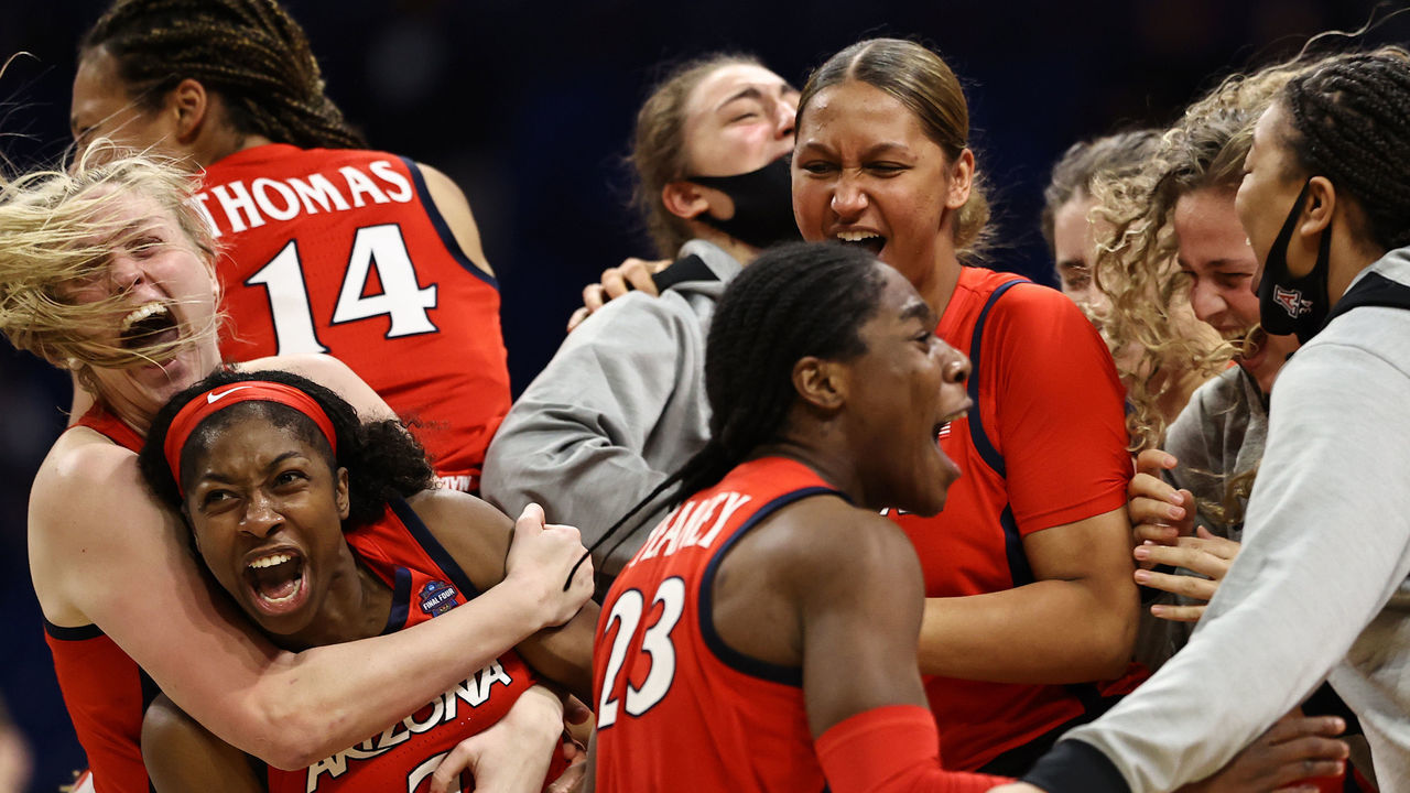 SAN ANTONIO, TEXAS - APRIL 02: Aari McDonald #2 of the Arizona Wildcats celebrates with teammates after defeating the UConn Huskies during the third quarter in the Final Four semifinal game of the 2021 NCAA Women's Basketball Tournament at the Alamodome on April 02, 2021 in San Antonio, Texas.