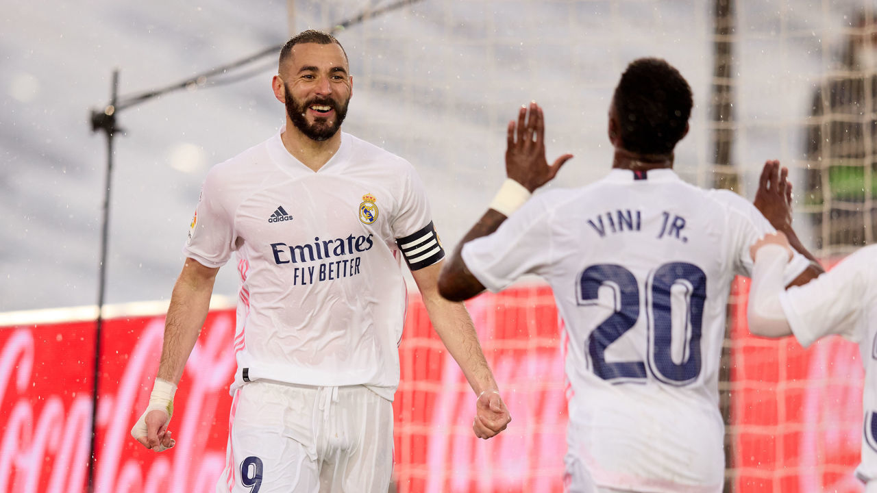 MADRID, SPAIN - APRIL 03: Karim Benzema of Real Madrid celebrates with Vinicius Junior and Sergio Arribas after scoring their side's second goal during the La Liga Santander match between Real Madrid and SD Eibar at Estadio Alfredo Di Stefano on April 03, 2021 in Madrid, Spain. Sporting stadiums around Spain remain under strict restrictions due to the Coronavirus Pandemic as Government social distancing laws prohibit fans inside venues resulting in games being played behind closed doors.