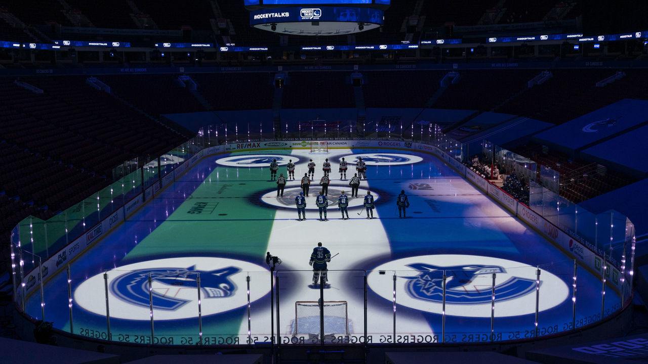 VANCOUVER, BC - JANUARY 27: The Vancouver Canucks and the Ottawa Senators acknowledge the program Hockey Talks prior to their NHL game at Rogers Arena on January 27, 2021 in Vancouver, Canada.