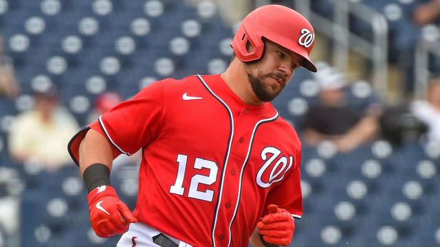 WEST PALM BEACH, FL - MARCH 03: Kyle Schwarber #12 of the Washington Nationals rounds first base after hitting a home run during the second inning of the spring training game against the Miami Marlins at The Ballpark of The Palm Beaches on March 3, 2021 in West Palm Beach, Florida.