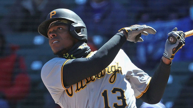 CHICAGO, ILLINOIS - APRIL 01: Ke'Bryan Hayes #13 of the Pittsburgh Pirates hits a two run home run in the 1st inning against the Chicago Cubs during the Opening Day home game at Wrigley Field on April 01, 2021 in Chicago, Illinois.