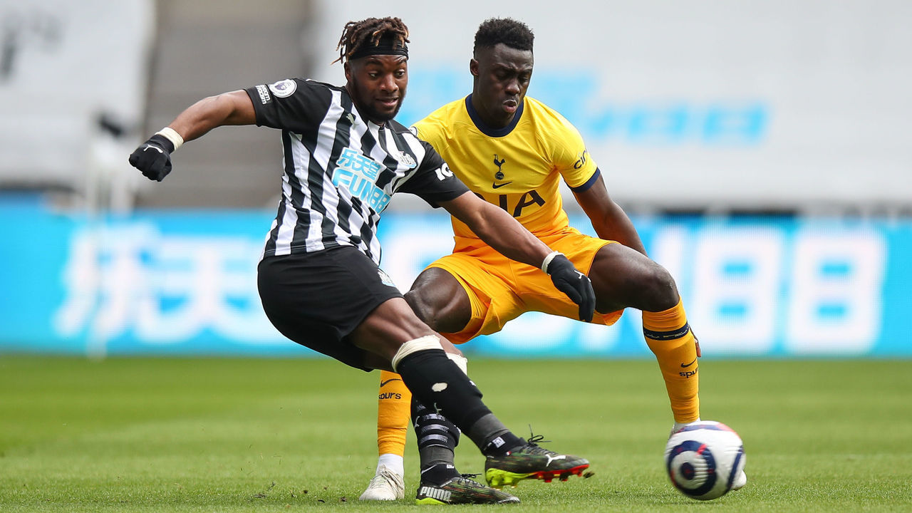 NEWCASTLE UPON TYNE, ENGLAND - APRIL 04: Allan Saint-Maximin of Newcastle United and Davinson Sanchez of Tottenham Hotspur during the Premier League match between Newcastle United and Tottenham Hotspur at St. James Park on April 4, 2021 in Newcastle upon Tyne, United Kingdom. Sporting stadiums around the UK remain under strict restrictions due to the Coronavirus Pandemic as Government social distancing laws prohibit fans inside venues resulting in games being played behind closed doors.
