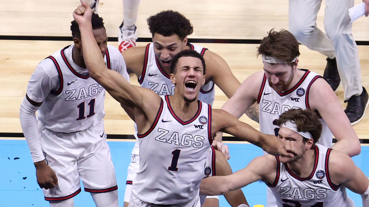 INDIANAPOLIS, INDIANA - APRIL 03: Jalen Suggs #1 of the Gonzaga Bulldogs celebrates with teammates after making a game-winning three point basket in overtime to defeat the UCLA Bruins 93-90 during the 2021 NCAA Final Four semifinal at Lucas Oil Stadium on April 03, 2021 in Indianapolis, Indiana.
