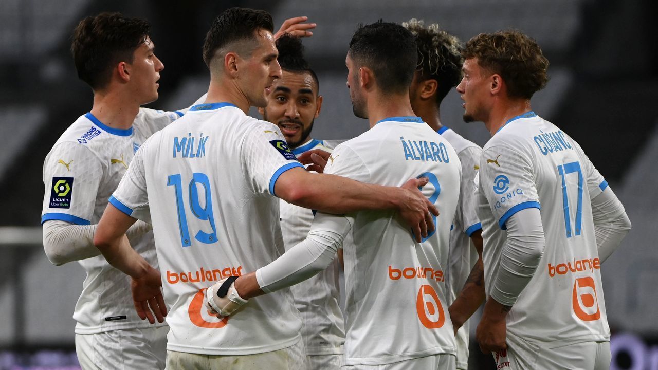 Marseille's Spanish defender Alvaro Gonzalez celebrates with teammates after scoring a goal during the French L1 football match between Olympique de Marseille (OM) and Dijon FCO at the Stade Velodrome in the southern French city of Marseille on April 4, 2021.