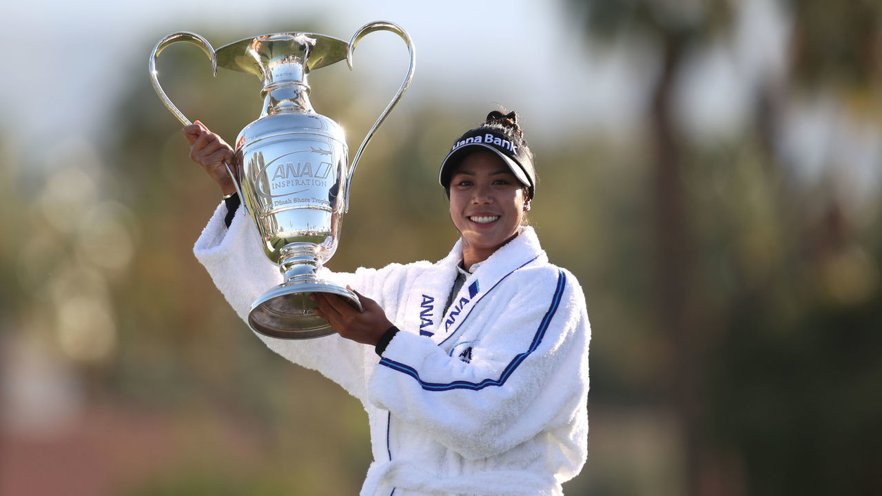 RANCHO MIRAGE, CALIFORNIA - APRIL 04: Patty Tavatanakit of Thailand celebrates with the trophy after winning the final round of the ANA Inspiration at the Dinah Shore course at Mission Hills Country Club on April 04, 2021 in Rancho Mirage, California.