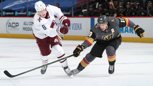 DENVER, COLORADO - MARCH 25: Reilly Smith #19 of the Golden Knights attempts to stop a shot by Cale Makar #8 of the Colorado Avalanche at Ball Arena on March 25, 2021 in Denver, Colorado.