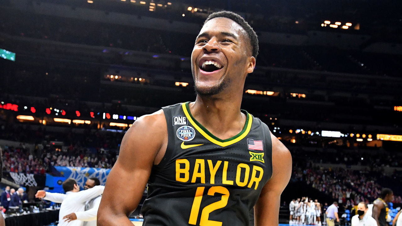 INDIANAPOLIS, INDIANA - APRIL 05: Davion Mitchell #45and Jared Butler #12 of the Baylor Bears elebrate their win against the Gonzaga Bulldogs in the National Championship game of the 2021 NCAA Men's Basketball Tournament at Lucas Oil Stadium on April 05, 2021 in Indianapolis, Indiana.