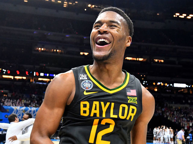 INDIANAPOLIS, INDIANA - APRIL 05: Davion Mitchell #45and Jared Butler #12 of the Baylor Bears elebrate their win against the Gonzaga Bulldogs in the National Championship game of the 2021 NCAA Men's Basketball Tournament at Lucas Oil Stadium on April 05, 2021 in Indianapolis, Indiana.