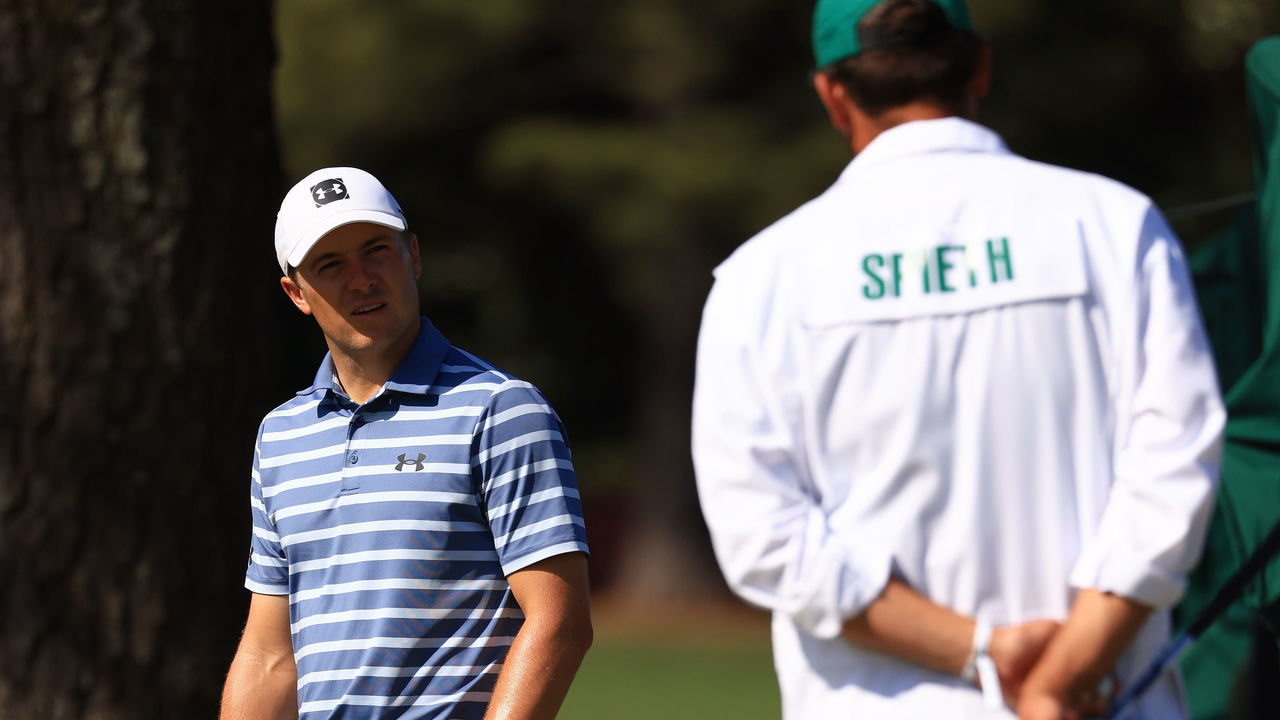 AUGUSTA, GEORGIA - APRIL 05: Jordan Spieth of the United States talks with his caddie Michael Greller during a practice round prior to the Masters at Augusta National Golf Club on April 05, 2021 in Augusta, Georgia.