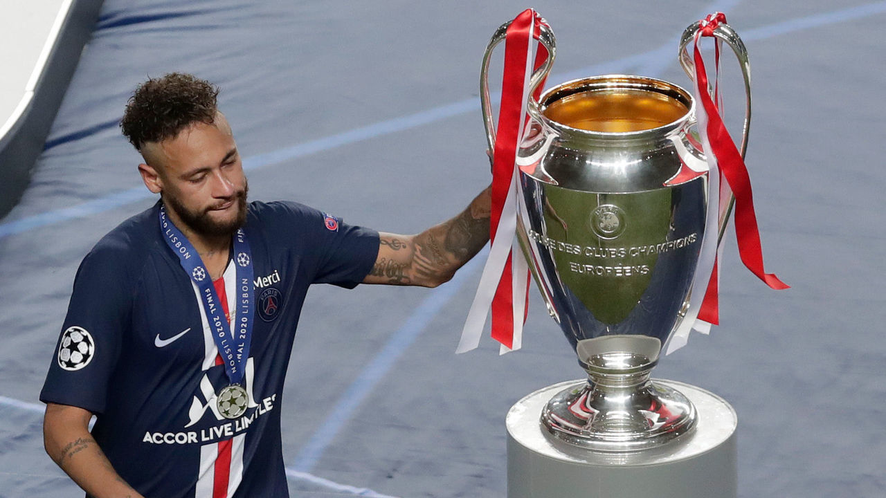 LISBON, PORTUGAL - AUGUST 23: Neymar of Paris Saint-Germain touches the UEFA Champions League Trophy as he looks dejected with his runners up medal following his team's defeat in the UEFA Champions League Final match between Paris Saint-Germain and Bayern Munich at Estadio do Sport Lisboa e Benfica on August 23, 2020 in Lisbon, Portugal.