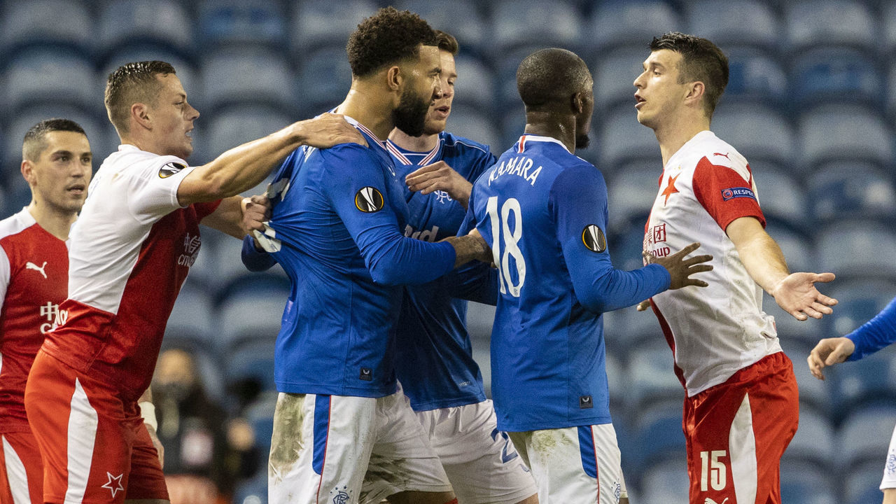 GLASGOW, SCOTLAND - MARCH 18: Rangers' Glen Kamara takes exception to something said by Slavia's Ondrej Kudela (left) during the UEFA Europa League Round of 16 2nd Leg match between Rangers FC and Slavia Prague at Ibrox Stadium on March 18, 2021, in Glasgow, Scotland.