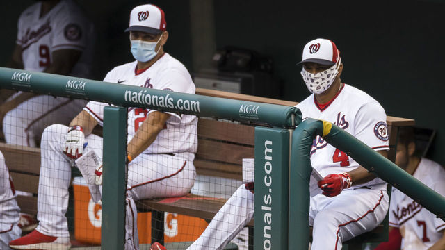 WASHINGTON, DC - JULY 21: Manager Dave Martinez #4 and bench coach Tim Bogar #24 of the Washington Nationals look on from the dugout during the second inning of the game against the Baltimore Orioles at Nationals Park on July 21, 2020 in Washington, DC.