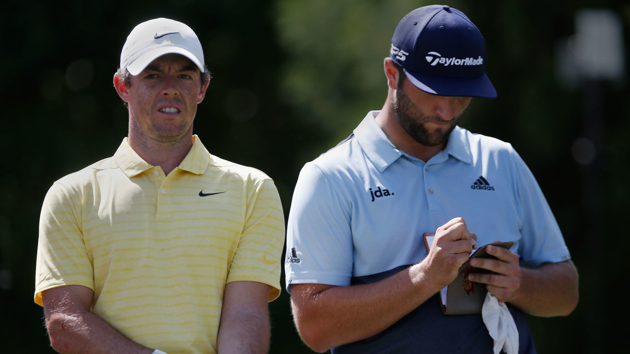 ATLANTA, GA - AUGUST 22: Rory McIlroy (L) and Jon Rahm prepare to tee off during the first round of the TOUR Championship, at East Lake Golf Club on August 22, 2019 in Atlanta, GA.