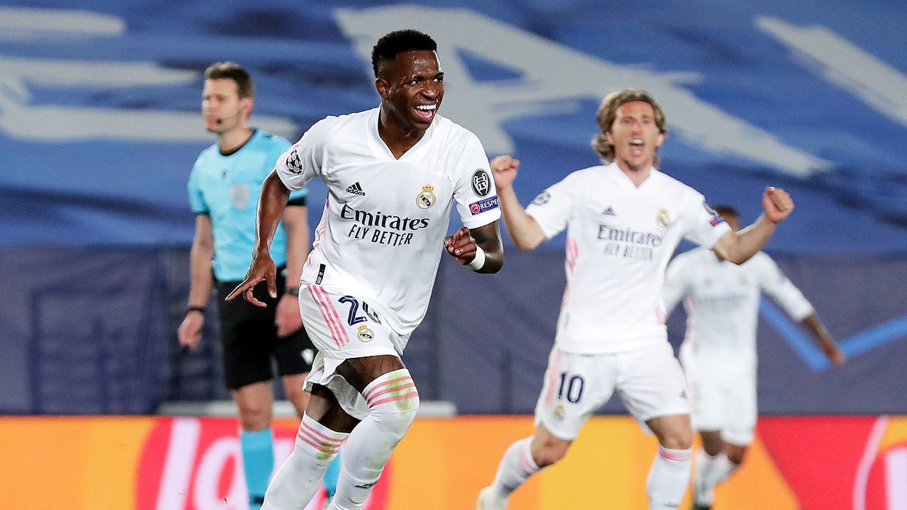 MADRID, SPAIN - APRIL 06: Vinicius Junior of Real Madrid celebrates after scoring their team's third goal during the UEFA Champions League Quarter Final match between Real Madrid and Liverpool FC at Estadio Alfredo Di Stefano on April 06, 2021 in Madrid, Spain. Sporting stadiums around Spain remain under strict restrictions due to the Coronavirus Pandemic as Government social distancing laws prohibit fans inside venues resulting in games being played behind closed doors.