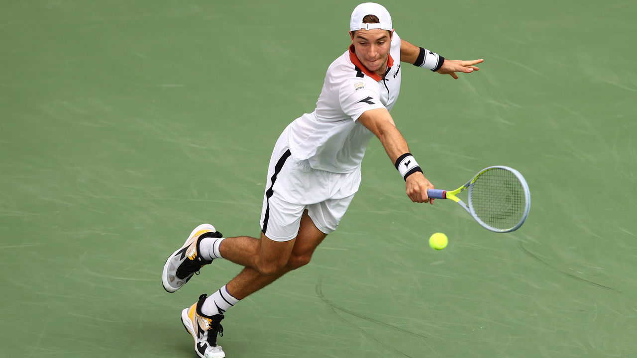 DUBAI, UNITED ARAB EMIRATES - MARCH 16: Jen-Lennard Struff of Germany plays a backhand during his singles match against Denis Shapovalov of Canada during Day Ten of the Dubai Duty Free Tennis at Dubai Duty Free Tennis Stadium on March 16, 2021 in Dubai, United Arab Emirates.